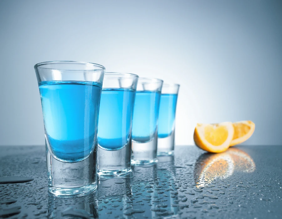 kamikaze shots with lemon wedges