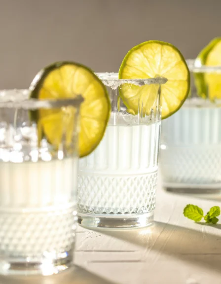 lemon drop layered shooter with sugar coated lemon wedge