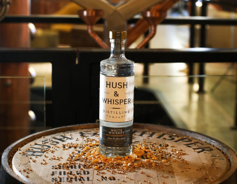 hush and whisper white whiskey on charred oak barrel