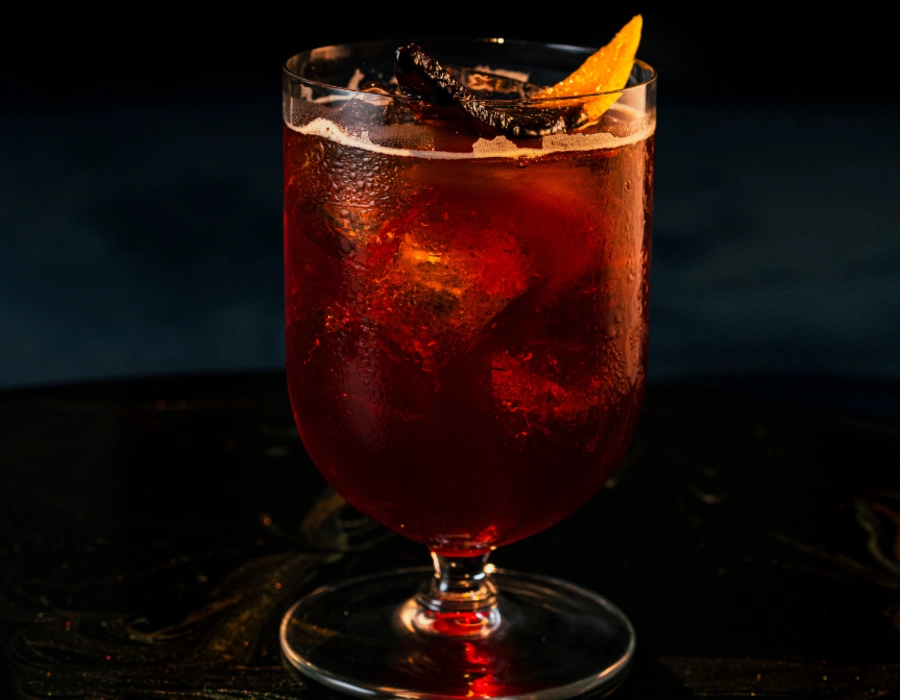 sweet gin cocktail served with orange peel