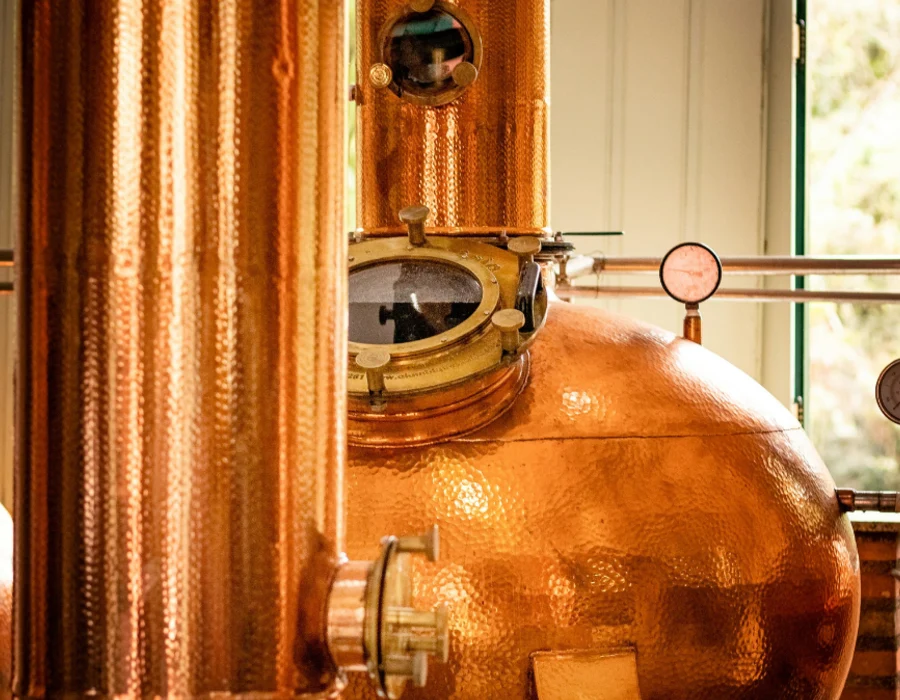 vodka makers busy with distillation process involving ethyl alcohol