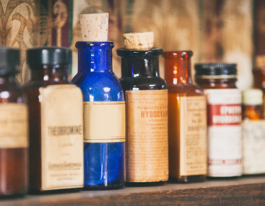 vintage medicine bottles and origins of gin and jenever to combat bubonic plague
