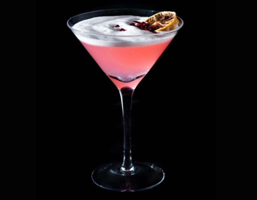 gin cocktail topped with champagne