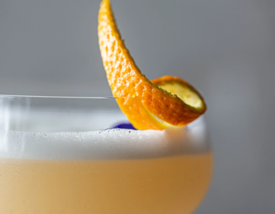cocktail with orange peel garnish