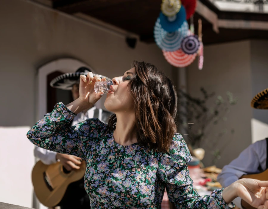 woman drinking vodka shot