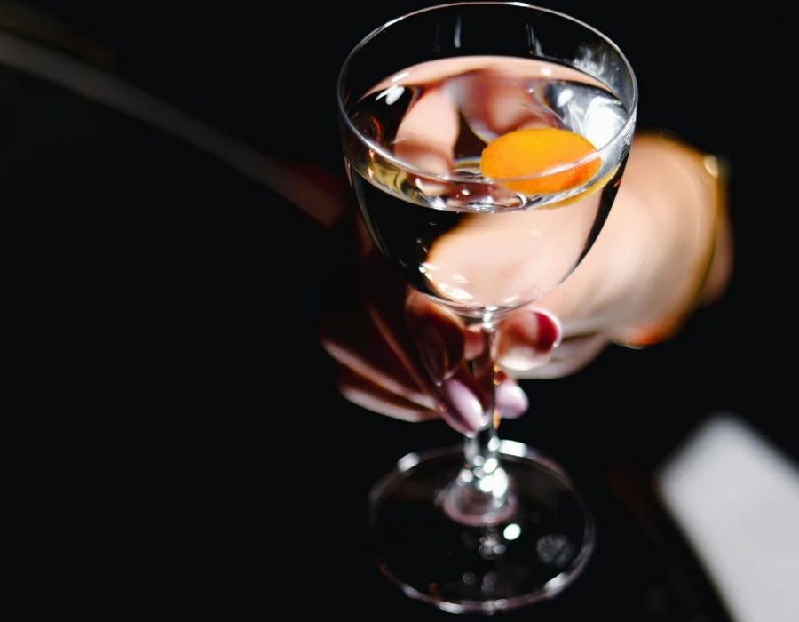woman holding cocktail