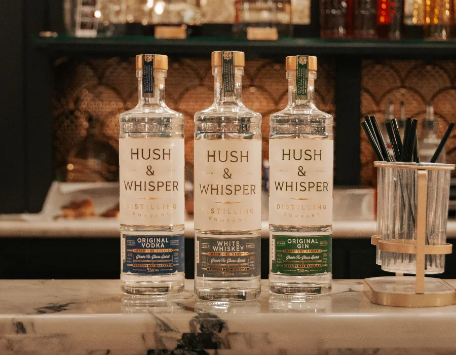 hush and whisper spirits on the bar