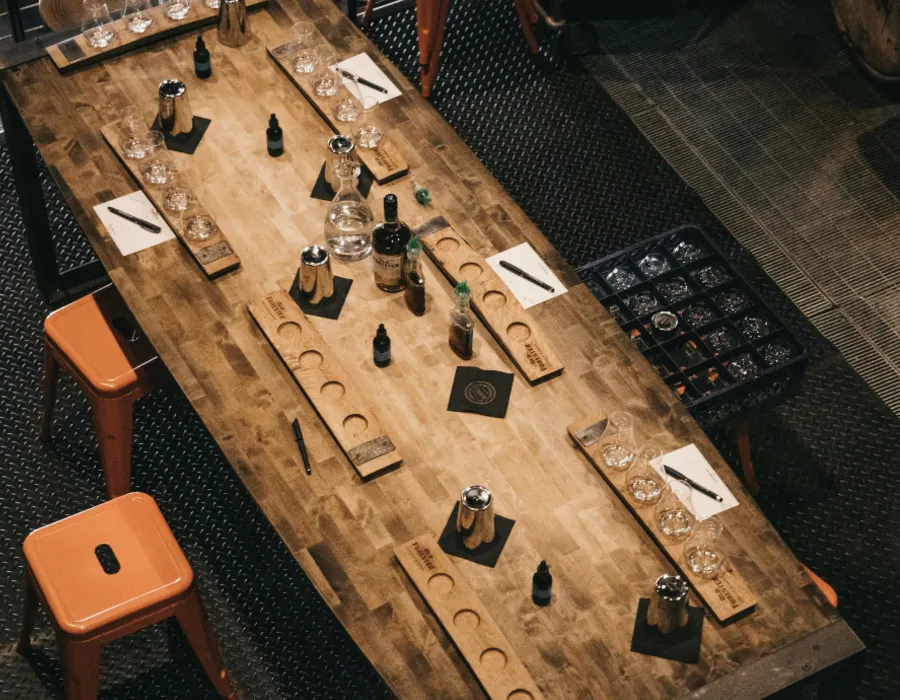 long table with whiskey and tasting glasses