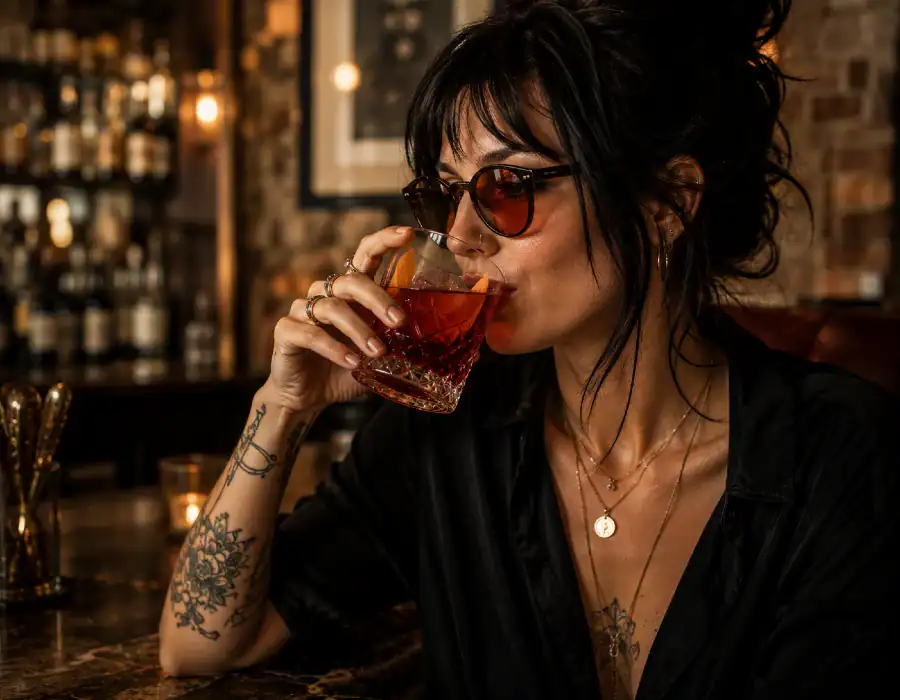 woman drinking negroni