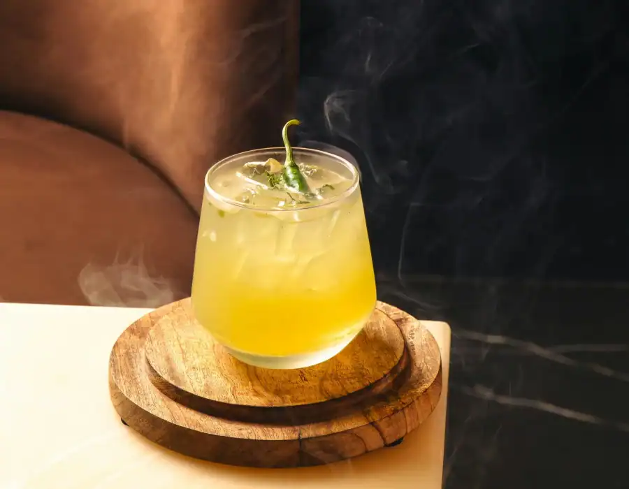 cocktail with jalapeno as garnish