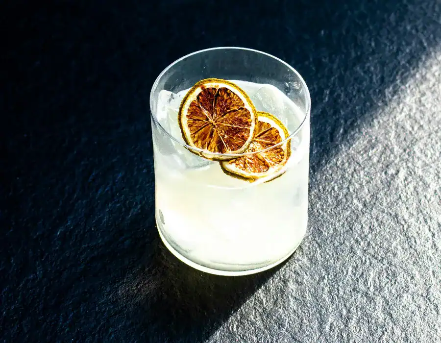 lemon vodka cocktail on slate surface