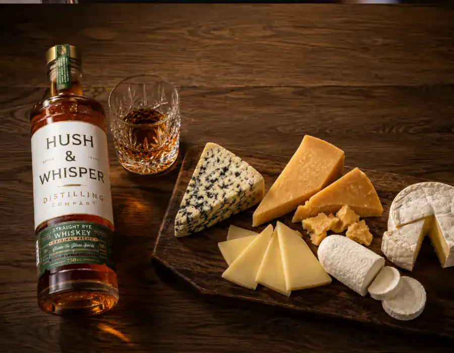 rye whiskey next to cheese platter