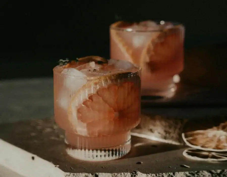stylished shot of cocktails on limestone block